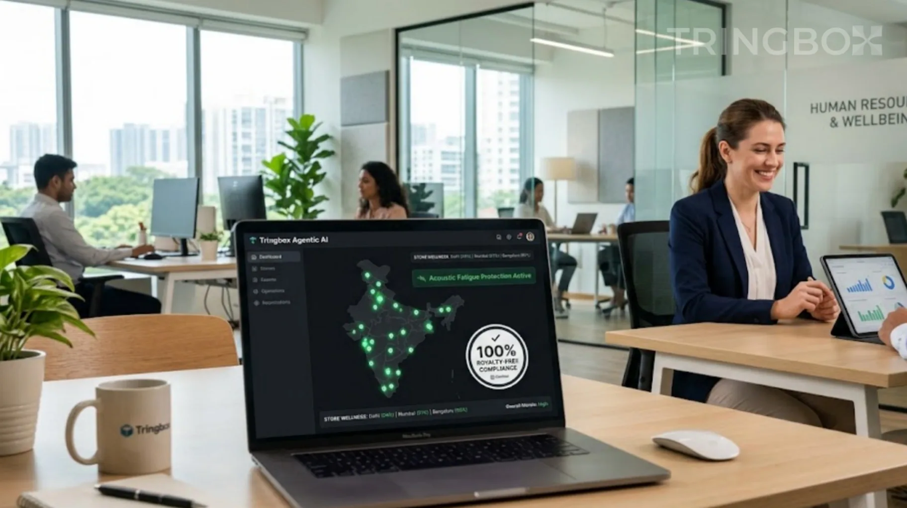 Large retail enterprise HR office with a central dashboard showing compliant stores across India via Tringbox AI